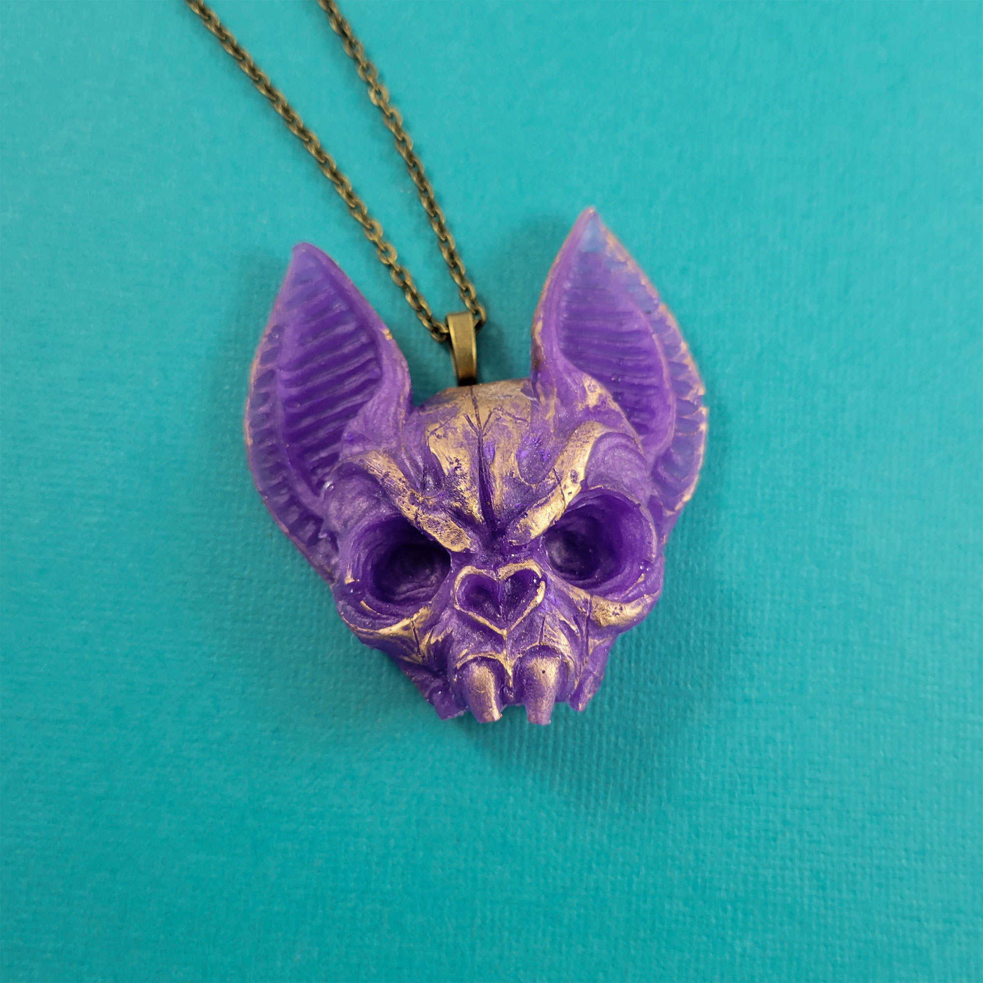 Purple & Gold Flying Death Bat Skull Necklace by Wilde Designs