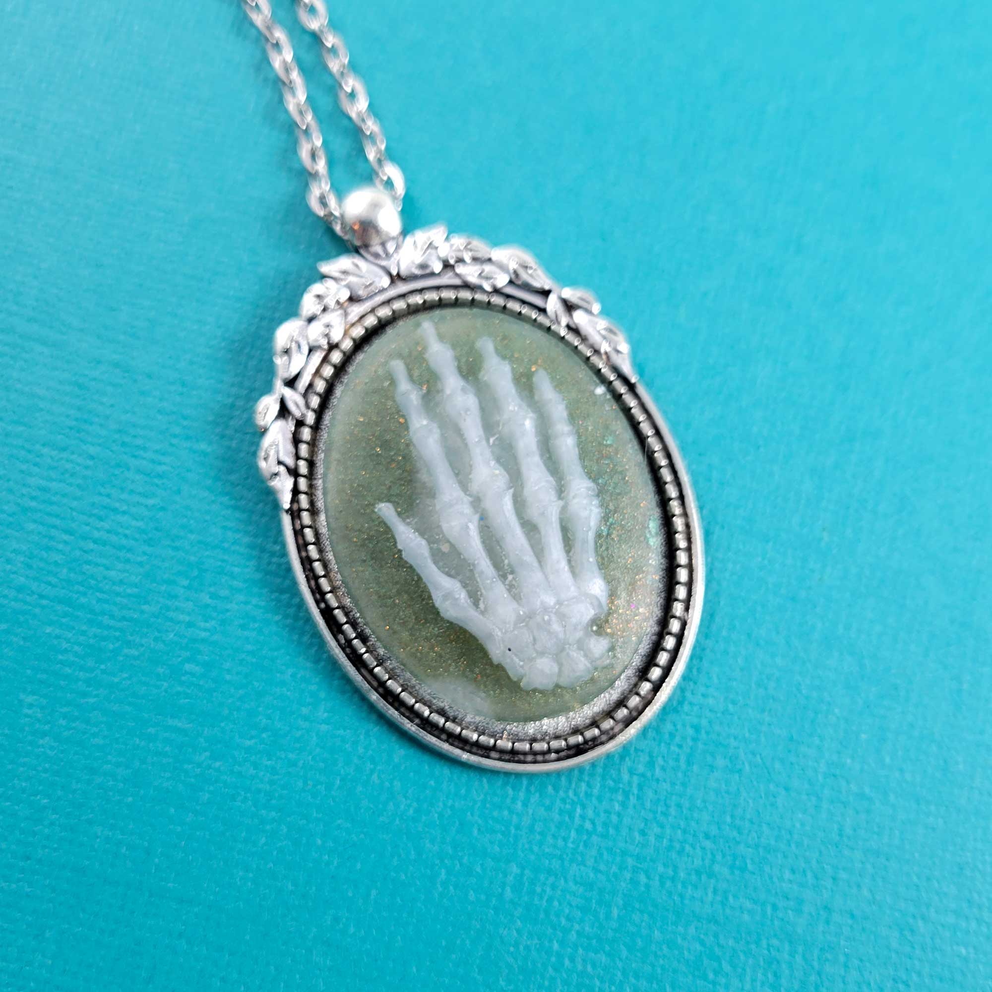 White & Green Hand of Death Necklace by Wilde Designs