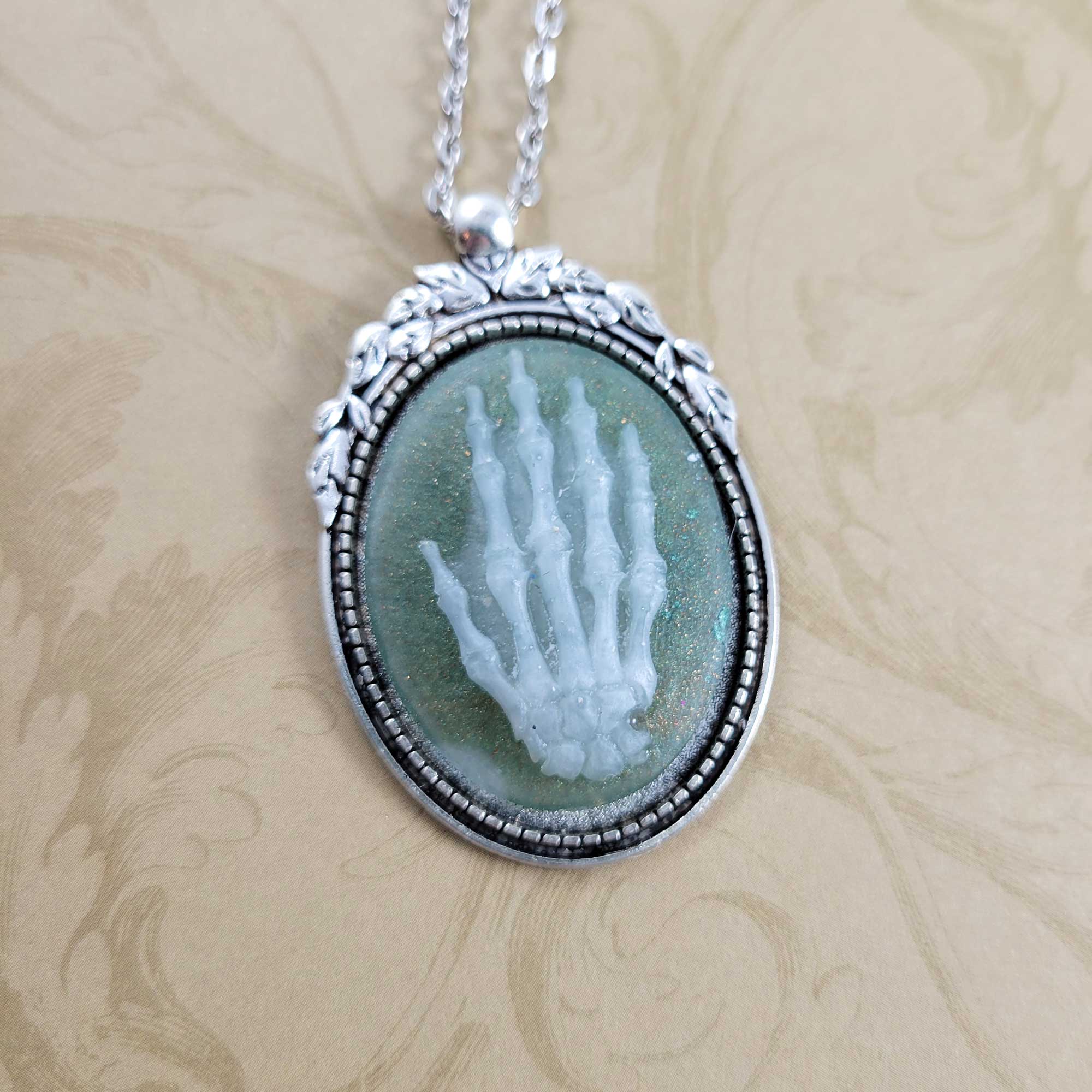 White & Green Hand of Death Necklace by Wilde Designs